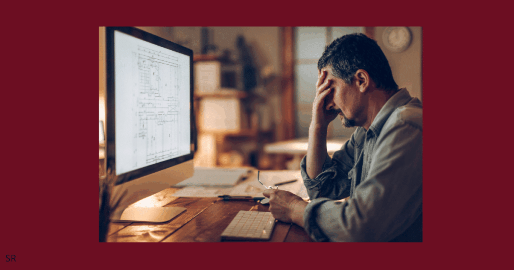 an image showing a person upset  and stressed out while doing his work